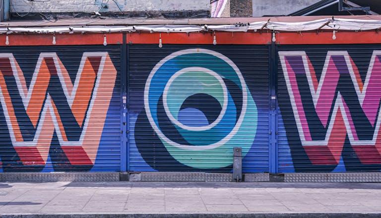Graffiti on the Roller Shutters in a Building in City